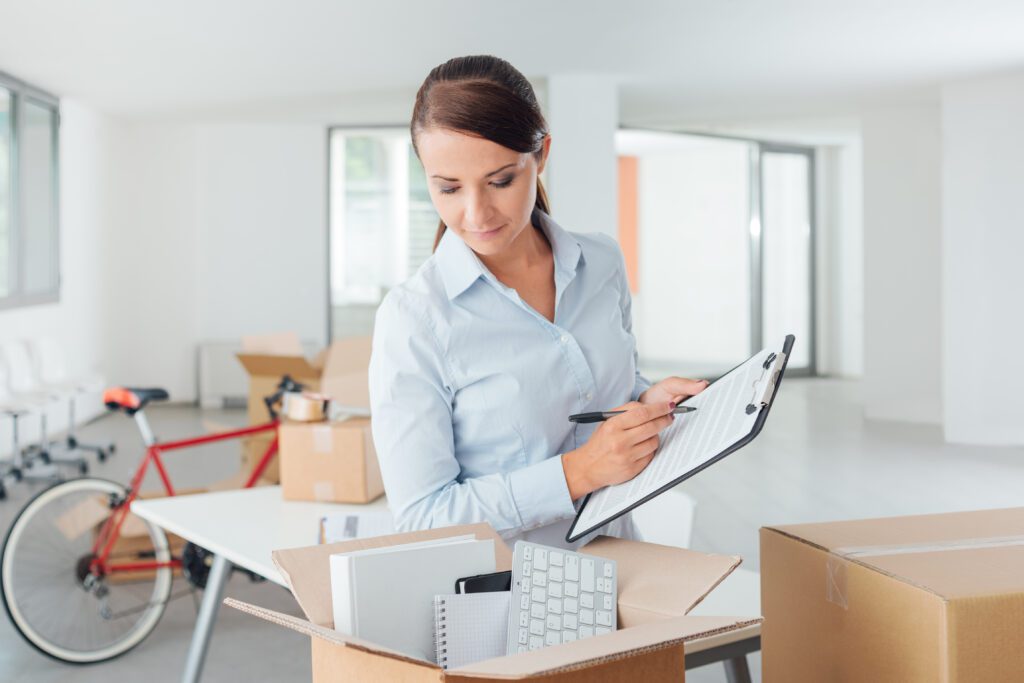 A woman creating a checklist for her move
